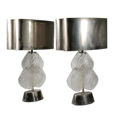 PAIR MURANO GLASS LEAF & POLISHED STAINLESS TABLE LAMPS | Pair of lamps with oval aluminum shade over frosted glass leaves
h. 32 x w....