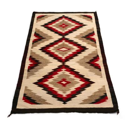ANTIQUE NAVAJO GANADO WEAVING | early/mid 20th century, having three diamonds with black, red, and natural dyes
w. 56 x l. 102 in.
