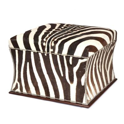 BESPOKE ZEBRA UPHOLSTERED OTTOMAN (2 OF 3) | large box-form ottoman overupholstered on all sides with zebra hide, tack border, and a...