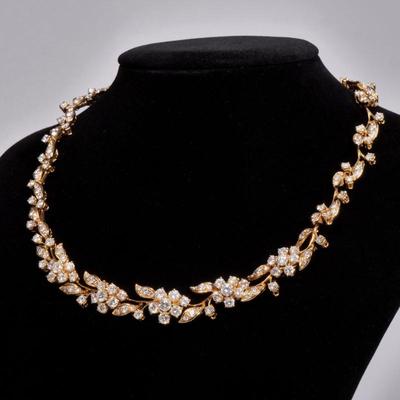 FRENCH DIAMOND & 18K GOLD VINE NECKLACE | Designed as a graduated pattern of 18k gold figured leafy vines mounting clusters of...