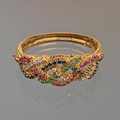 JACK GUTSCHNEIDER FLORAL GEMSTONE & 18K GOLD BRACELET | Midcentury modern, hinged hard bracelet with 18k yellow gold openwork design,...