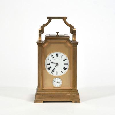 A FANCY THEODORE B. STARR CARRIAGE / TRAVEL CLOCK | Numbered and engraved on bottom.  Handle moves back and forth and glass reveals...