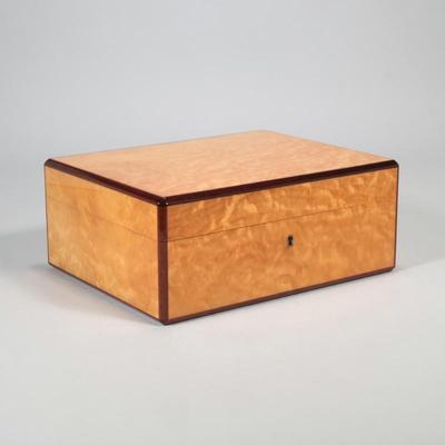 A FINE NAT SHERMAN BURLWOOD INLAY BOX HUMIDOR | Brass hardware, interior marked "Nat Sherman / New York"
h. 4.75 x l. 11.5 x d....