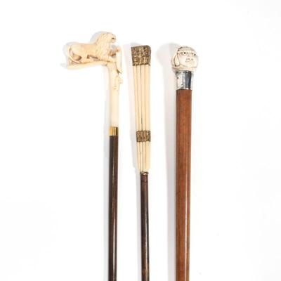 (3pc) COLLECTION OF THREE VICTORIAN CARVED BONE HANDLED WALKING STICKS | Including; one with an L-shaped handle with a richly carved lion...