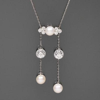 ANTIQUE ART DECO DIAMOND & NATURAL PEARL NECKLACE | C. 1900-1920, probably J.E. Caldwell, Philadelphia; designed as two fine-link...