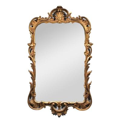 ITALIANATE GILT CARVED MIRROR WITH SHELL DEVICES | early 20th century, crested by a shell carving, with viney floral devices
h. 45 x w....
