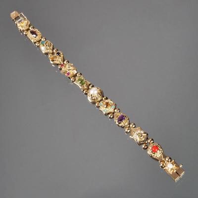COLORFUL GEMSTONE & 14K BRACELET | Designed as 12 unique links (one is a clasp) each mounting a different gemstone, including...