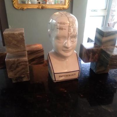 Marble book ends and pottery model of brain