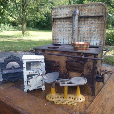 Sale Photo Thumbnail #12: Antique cast-iron kitchen toys stove w candle insert plus plus