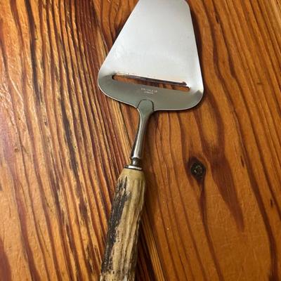 Made in Norway. Bone handle and stainless steel cheese slicer. 