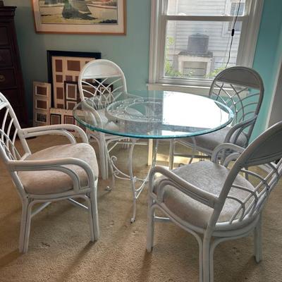 Lovely set of four bamboo chairs and glass top table. 