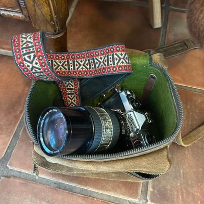 Vintage Nikon and Vivitar lens camera. Includes strap. 