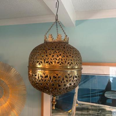 Hanging solid brass piece. 