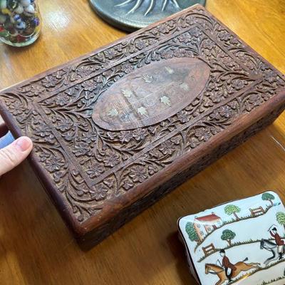Carved lined interior wood box. 