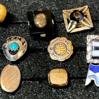 Twelve tie pins one gold