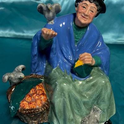 Royal doulton figurine titled tuppence a bag"