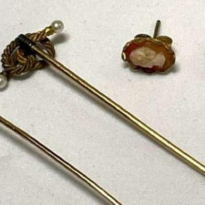 Vintage stick pins complementing earrings