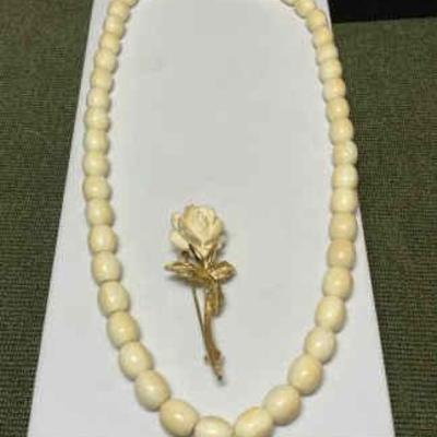 Boucher brooch complementing necklace