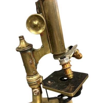 Sale Photo Thumbnail #125: Antique c 1880-90 Brass Microscope by Gundlach, Rochester, New York. Measures 1/2"x4"x12 1/2". Weight 7 lbs 10 oz