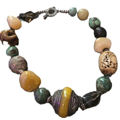 Sale Photo Thumbnail #62: Vintage Chunky Tribal Carved Amber and Agate Stone Necklace. 