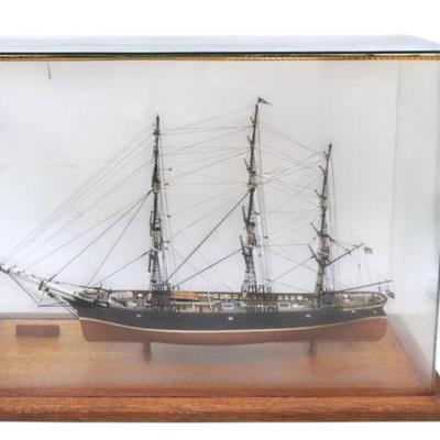 Sale Photo Thumbnail #120: .Vintage Young America Model Clipper Ship in Glass Case. The Young America was a renowned clipper ship built in 1853, celebrated for its speed and significant contributions to maritime trade, particularly between the East Coast and California. In case 24"