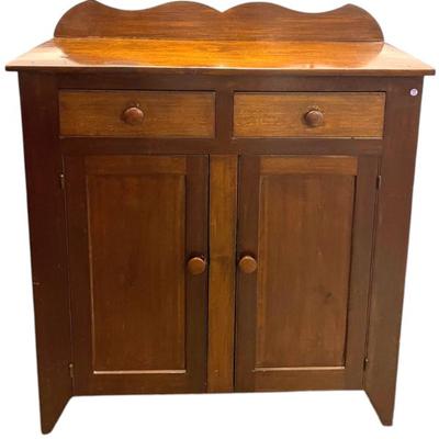 Sale Photo Thumbnail #181: Antique American Jelly Cupboard. With 2 drawers over 2 doors that open to 3 shelves. Measures 52"x43.5"x16.75"