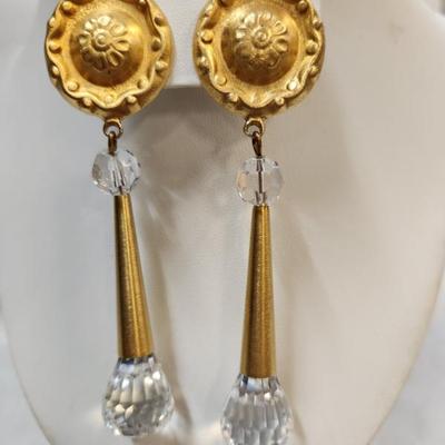 Sale Photo Thumbnail #65: A pair of long runway signed vintage 1980s Marcy Feld clip on earrings that have large facet cut clear crystals. Each measures 3.75"