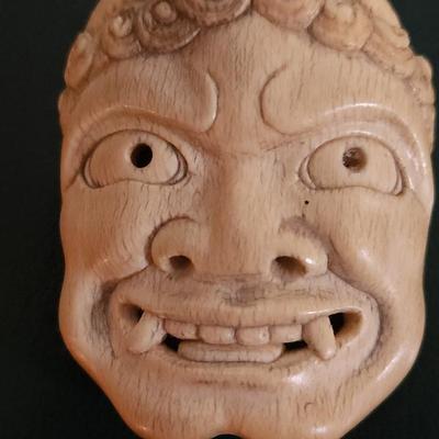 Sale Photo Thumbnail #41: Antique 18th/19th c Japanese Netsuke Oni Mask with exceptional carved detail. Measures 2.25"