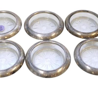 Sale Photo Thumbnail #277: Set of 6 Vintage Frank M. Whiting Sterling Silver Coasters with Glass Inserts.The coasters feature a classic starburst pattern in the glass and beaded edging around the rims.Each Measure 4" dia.