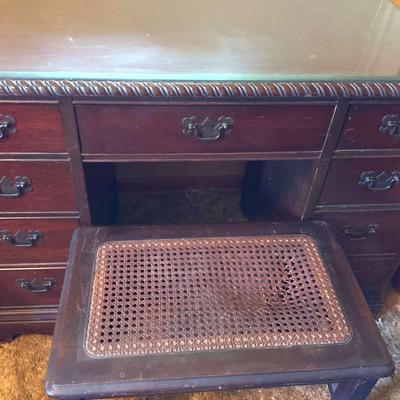 Lot 148:  Vintage Mahogany Kneehole Writing Desk with Glass Top & Cane Bench