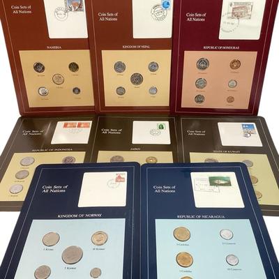 104) 8 Pages Of Uncirculated Foreign Coins
