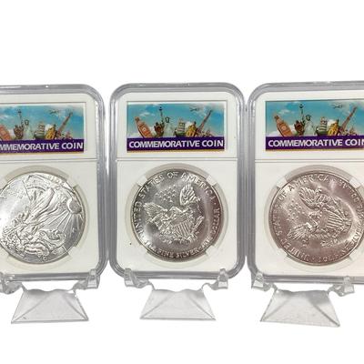 79) Three Holdered Silver Coins 