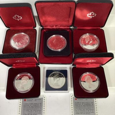 84) Seven Canada Silver Dollars