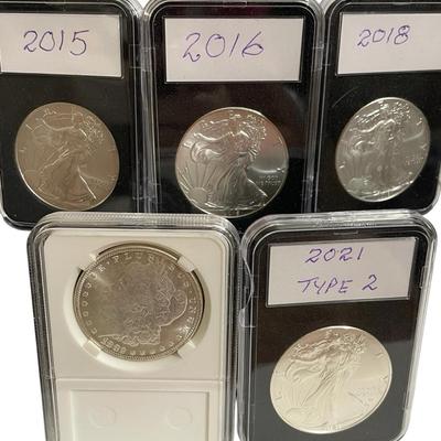 7) Four Silver Eagle’s & Morgan Dollar