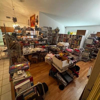 Livingroom is filled with collections and collectibles ranging from stamps to board games, cook books, glassware and china. Hand made and...