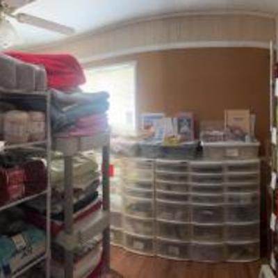 Back room is the craft room. Filled with candles, mason jars, quilting materials, cross stitch, light brights, knitting and crocheting...