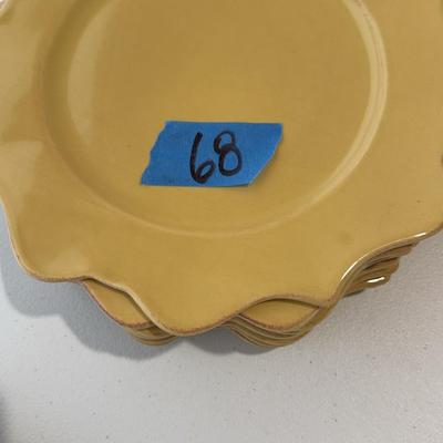 Eight Mustard Colored Flower Shaped Plates