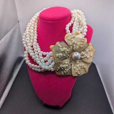 Striking Multi strand Faux Pearl Necklace With Large Ornate Flower Shaped Pendant 