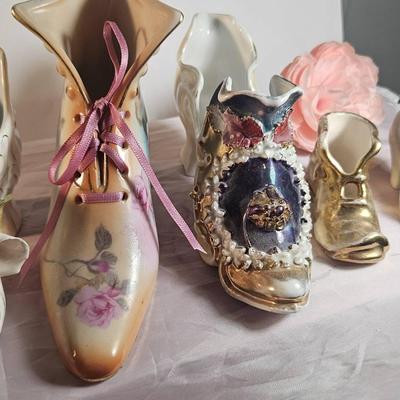 Charming collection of six decorative miniature shoe figurines in assorted styles and finishes. 