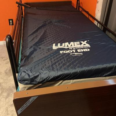 Twin bed with rails and sleeping position adjustment