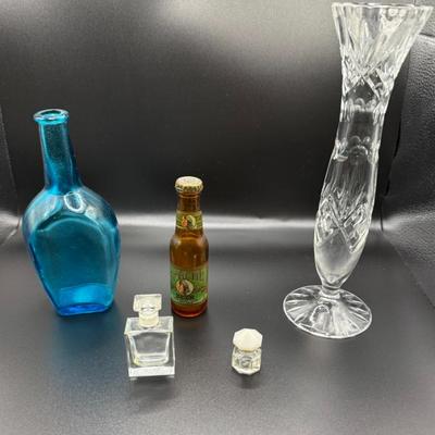 Lot Vintage Japan Blue Glass Bottle, Apache Beer Salt Shaker, Perfume Bottles & Crystal Vase
Lot #: 139