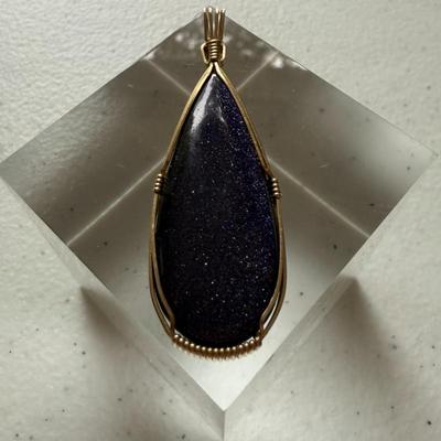 Large Polished Blue Goldstone Pendant Wrapped W/Gold-filled Wire
Lot #: 51