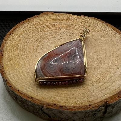 Gorgeous Large Rose/Purple Polished Stone Pendant W/Garnet Beads- Wrapped In Gold-filled Wire
Lot #: 53