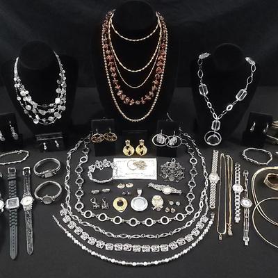 Silver Tone And Gold Tone Jewelry And Watches Featuring Aigner
