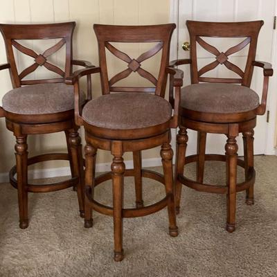 Three Wooden Swivel Seat Barstools With Upholsted Seats 