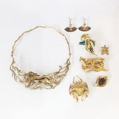 Lot #191 - Gold Toned Jewelry: Mid Century Brutalist Lion Necklace and Assorted Animal Brooches & Enameled Earrings
