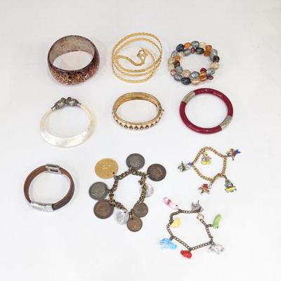 Lot #214 - Assorted Vintage Bangles & Charm Bracelets Collection