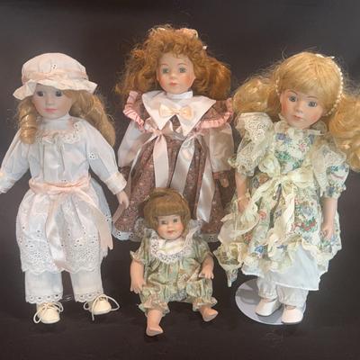 Lot of 4 vintage Porcelain dolls 