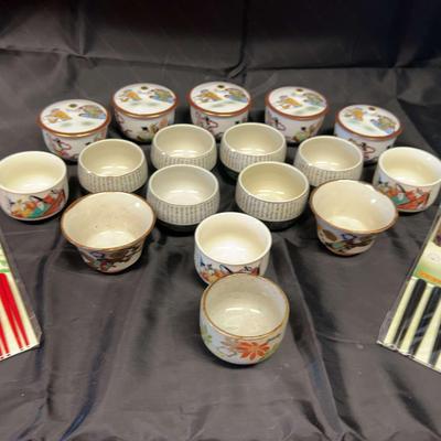 Collection Of Asian Themed Teacups And Chopsticks