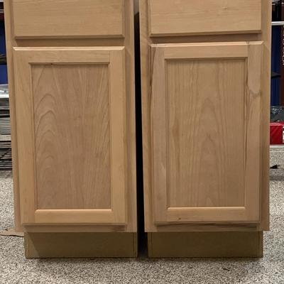 Two wooden storage cabinets